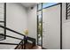 Stylish foyer featuring a modern front door, sleek bench, and minimalist design at 356 S Osceola Ave # 19, Orlando, FL 32801
