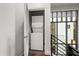 Convenient laundry area featuring a stacked washer and dryer unit and natural light from windows at 356 S Osceola Ave # 19, Orlando, FL 32801