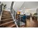Open-concept living area with sleek staircase, modern dining set, and comfortable seating at 356 S Osceola Ave # 19, Orlando, FL 32801