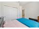 Bright bedroom with sliding closet, and comfortable bed at 3566 Southern Cross Loop, Kissimmee, FL 34744
