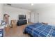 Spacious bedroom with a TV, dresser, closet and bed at 3566 Southern Cross Loop, Kissimmee, FL 34744