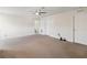 Large bonus room with beige carpet and an entrance to a bathroom at 3566 Southern Cross Loop, Kissimmee, FL 34744