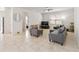 Spacious living room featuring tile flooring, neutral tones, and ample natural light at 3566 Southern Cross Loop, Kissimmee, FL 34744