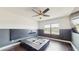 Modern bedroom featuring two-tone walls, a platform bed frame and dark flooring, offering a peaceful retreat at 4002 Scarlet Branch Rd, Orlando, FL 32824
