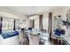 Dining room with modern chandelier, dark floors, and a clear dining table with seating for six at 4002 Scarlet Branch Rd, Orlando, FL 32824