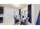 Bright dining area with glass-top table and comfortable upholstered chairs at 4002 Scarlet Branch Rd, Orlando, FL 32824