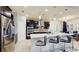 Modern kitchen features stainless appliances, dark cabinetry, pendant lights, and breakfast bar at 4002 Scarlet Branch Rd, Orlando, FL 32824