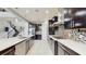 Spacious modern kitchen with stainless steel appliances, quartz countertops and an island with bar seating at 4002 Scarlet Branch Rd, Orlando, FL 32824