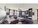 Open concept living room with large sectional sofa and entertainment center at 4002 Scarlet Branch Rd, Orlando, FL 32824