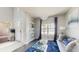 Comfortable living room with pendant lighting, light gray walls, dark floors and a large front window at 4002 Scarlet Branch Rd, Orlando, FL 32824