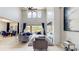 Spacious living room with soaring ceilings, statement fireplace, and outdoor view at 4002 Scarlet Branch Rd, Orlando, FL 32824