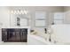 Bright main bathroom with soaking tub, dual vanity, and a large window at 4002 Scarlet Branch Rd, Orlando, FL 32824