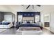 Beautiful main bedroom with king bed, ensuite bathroom, and seating area at 4002 Scarlet Branch Rd, Orlando, FL 32824