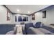 Home theater with comfortable seating, large screen, and dark walls at 4002 Scarlet Branch Rd, Orlando, FL 32824