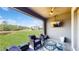 Cozy covered patio with a ceiling fan, outdoor seating and TV offering a relaxing outdoor entertainment space at 4002 Scarlet Branch Rd, Orlando, FL 32824