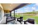 This outdoor patio features comfortable seating and a picturesque view of a serene lake at 4002 Scarlet Branch Rd, Orlando, FL 32824