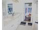 Bathroom with granite countertops and dual sinks, with closet access at 411 Evening Sky Dr, Oviedo, FL 32765