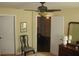 Well-lit bedroom with a ceiling fan, a chair, and carpet floors at 411 Evening Sky Dr, Oviedo, FL 32765