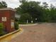 Gated community entrance with brick features and professional landscaping at 411 Evening Sky Dr, Oviedo, FL 32765