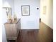 Entryway with hardwood floors, a decorative table, and a view of the hall at 411 Evening Sky Dr, Oviedo, FL 32765