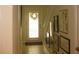 Inviting hallway with tile floors, bright lighting, and an array of stylish picture frames at 411 Evening Sky Dr, Oviedo, FL 32765