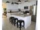 Bright kitchen features white cabinets, stainless steel appliances and granite countertops at 411 Evening Sky Dr, Oviedo, FL 32765