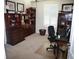 Bright office space with built-in shelves, a desk, and natural light from the window at 411 Evening Sky Dr, Oviedo, FL 32765