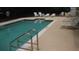 Community pool with several chairs and tables available for residents at 411 Evening Sky Dr, Oviedo, FL 32765
