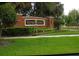 Community signage with professional landscaping welcomes you to River Oaks at 411 Evening Sky Dr, Oviedo, FL 32765