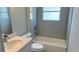 Well-lit bathroom featuring tub with neutral tile and modern fixtures at 4111 Sw 166Th Place Rd, Ocala, FL 34473