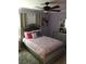 Cozy bedroom featuring a ceiling fan, stylish bed frame, and elegant decor at 4251 Anthony Lane, Orlando, FL 32822