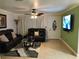 Cozy living room with leather sofas and neutral decor at 4251 Anthony Lane, Orlando, FL 32822