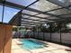 Screened-in pool area with brick pavers at 4251 Anthony Lane, Orlando, FL 32822