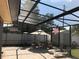 Screened-in pool area with patio furniture at 4251 Anthony Lane, Orlando, FL 32822