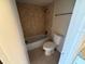 Bathroom with tiled shower and toilet at 4328 Aqua Vista Dr # B, Orlando, FL 32839