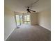 Bedroom with ceiling fan and view from large window at 4328 Aqua Vista Dr # B, Orlando, FL 32839