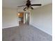 Bedroom with ceiling fan and doorway to bath area at 4328 Aqua Vista Dr # B, Orlando, FL 32839