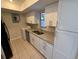 Kitchen with stainless steel appliances, granite countertops and modern white cabinets at 4328 Aqua Vista Dr # B, Orlando, FL 32839