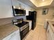 Modern kitchen with granite countertops, stainless steel appliances, and ample cabinet space at 4328 Aqua Vista Dr # B, Orlando, FL 32839