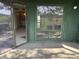 View of a screened patio, with sliding doors, window and view into the interior of the house at 4328 Aqua Vista Dr # B, Orlando, FL 32839