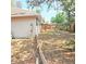 Image of a backyard with full wood fence and view of the house's exterior at 513 Rachael Ct, Oviedo, FL 32765