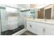 Modern bathroom with double sink vanity, walk-in shower and sleek fixtures plus luxurious tile at 513 Rachael Ct, Oviedo, FL 32765