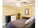 Comfortable bedroom with neutral colors, ceiling fan, and wood-look flooring plus ample closet space at 513 Rachael Ct, Oviedo, FL 32765
