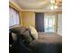 Bedroom features a sliding glass door and access to the screened in patio at 513 Rachael Ct, Oviedo, FL 32765