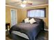 Well-appointed bedroom with a large window, a ceiling fan, and stylish wood-look flooring at 513 Rachael Ct, Oviedo, FL 32765