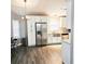 Bright kitchen features stainless steel appliances, farmhouse sink, and white cabinetry at 513 Rachael Ct, Oviedo, FL 32765