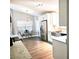 Bright kitchen features stainless steel appliances, farmhouse sink, and white cabinetry at 513 Rachael Ct, Oviedo, FL 32765