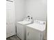 Functional laundry area with standard white washer and dryer units and a storage closet at 513 Rachael Ct, Oviedo, FL 32765