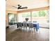 Covered patio with a dining table, chairs, and sliding glass doors at 513 Rachael Ct, Oviedo, FL 32765