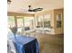 Covered patio with an outdoor dining table and chairs, and a ceiling fan at 513 Rachael Ct, Oviedo, FL 32765